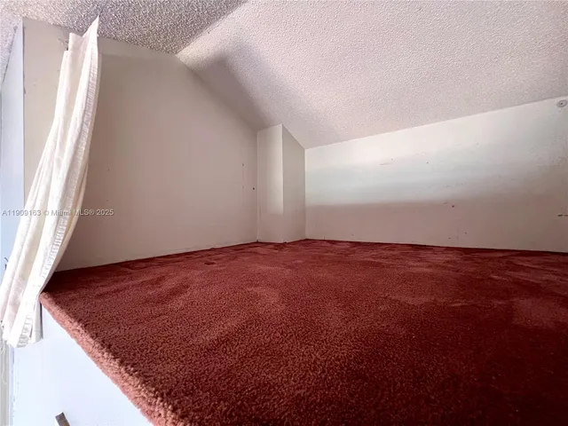 a bedroom with a bed and a table in it