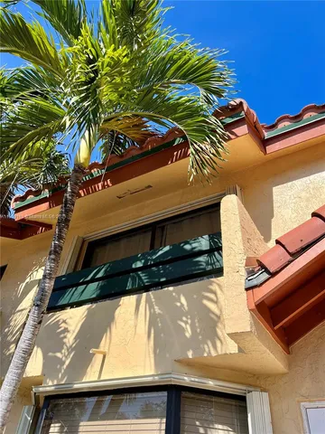 a view of a street with large trees