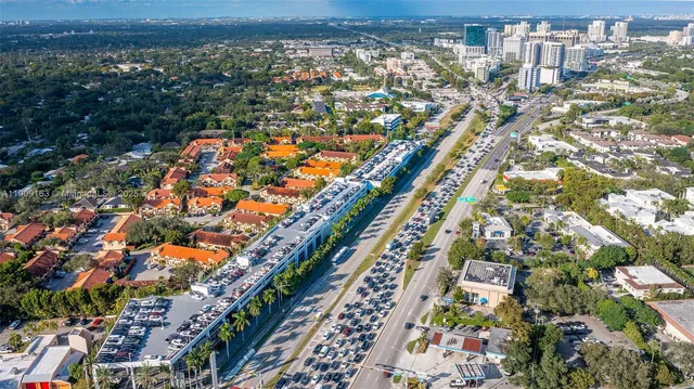 a house that has a tree in front of it