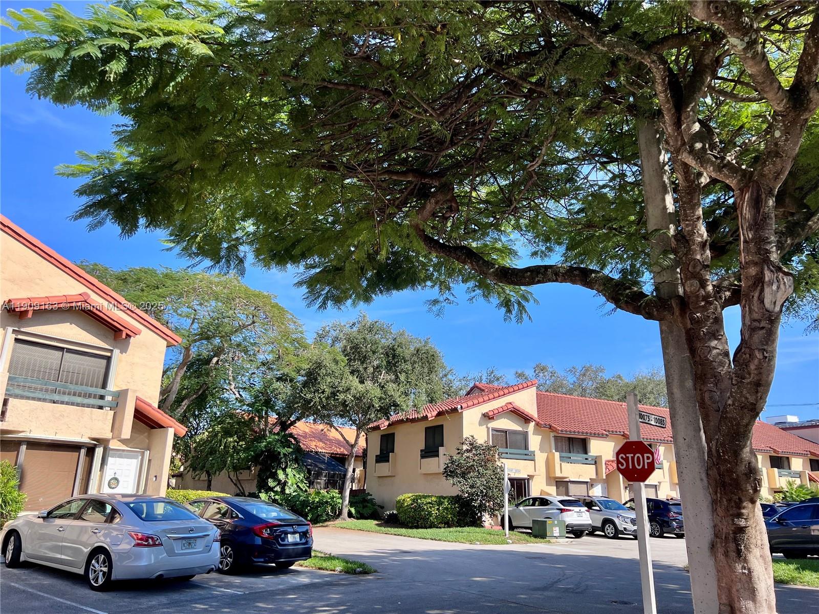 10037 Southwest 77th Court Miami, FL 33156 - Photo 57 of 70 a car parked in front of a building