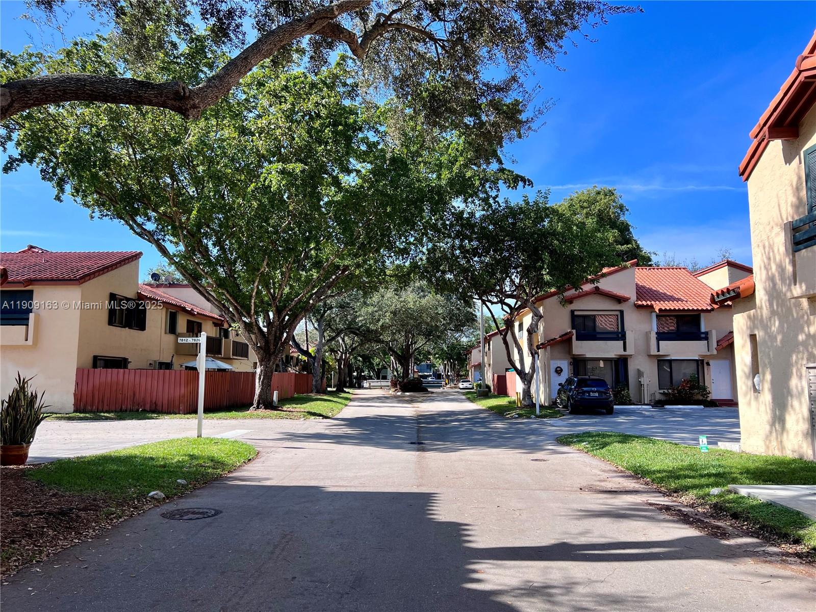 10037 Southwest 77th Court Miami, FL 33156 - Photo 66 of 70 a view of a house with a street