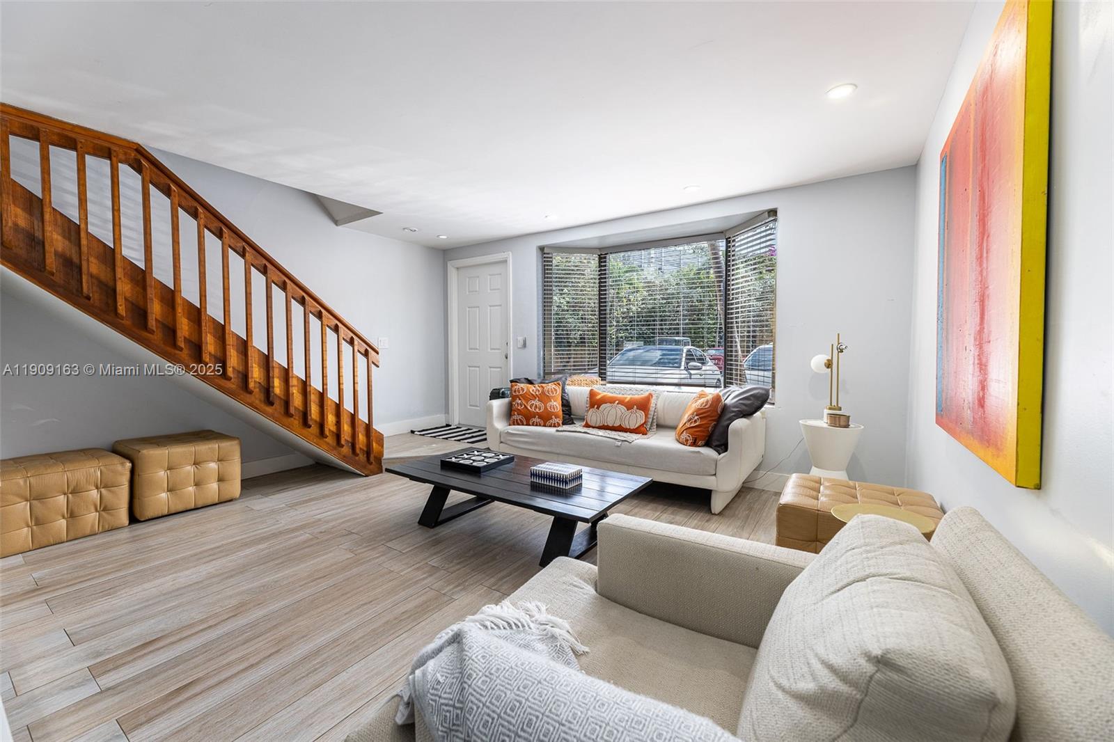 10037 Southwest 77th Court Miami, FL 33156 - Photo 7 of 70 a living room with furniture and a wooden floor