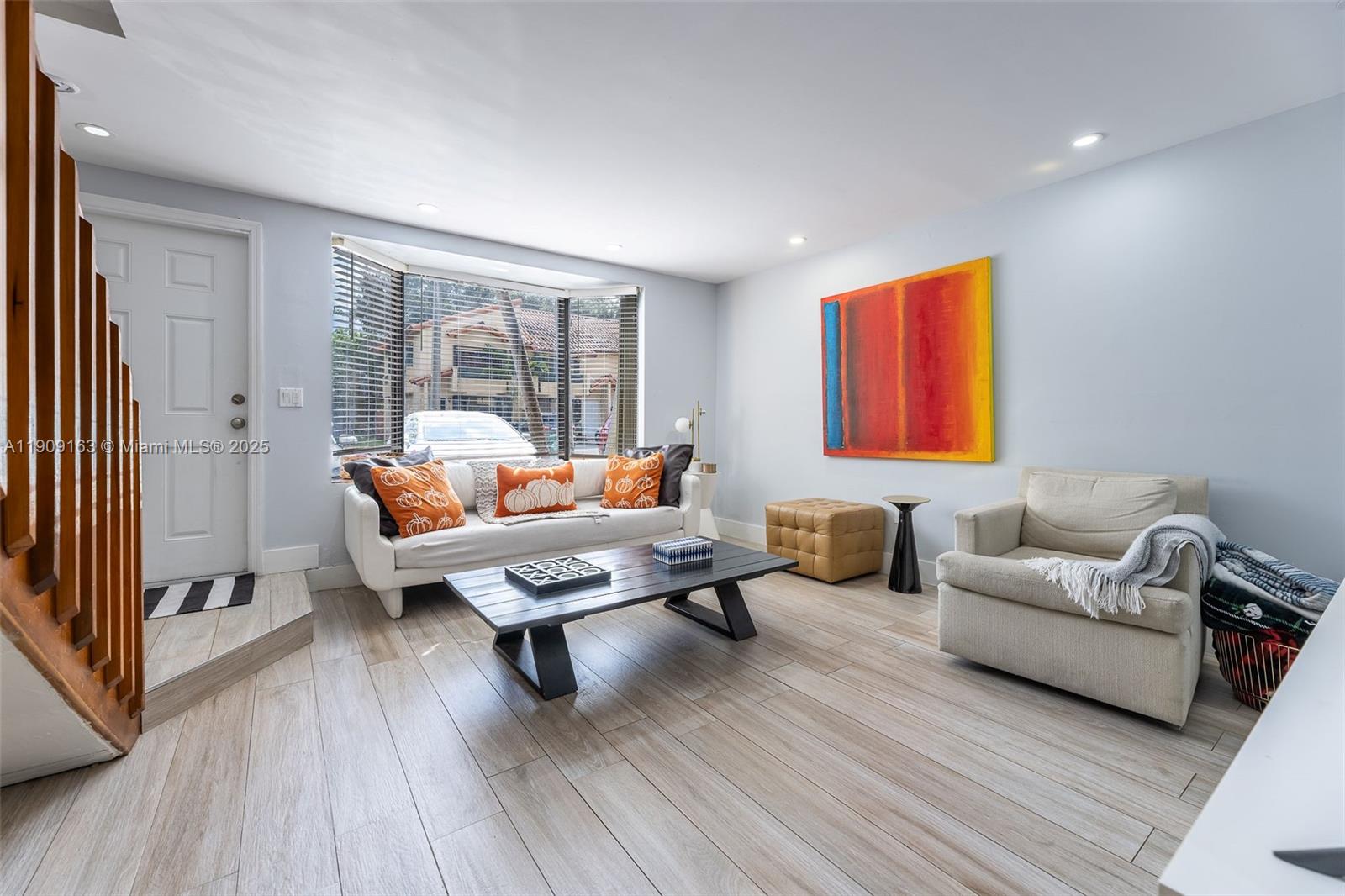10037 Southwest 77th Court Miami, FL 33156 - Photo 8 of 70 a living room with furniture and a wooden floor