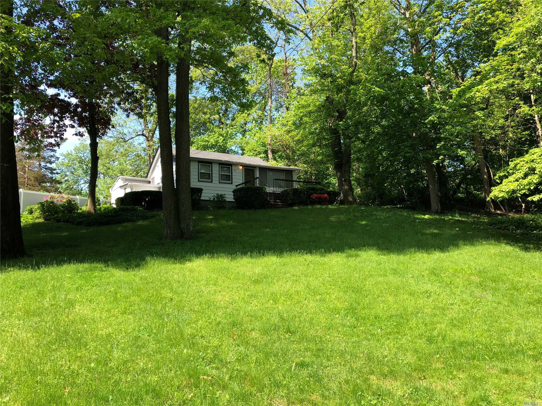 12 Nassau Road Sound Beach, NY 11789 - Photo 1 of 1 a view of a trees in front of a house