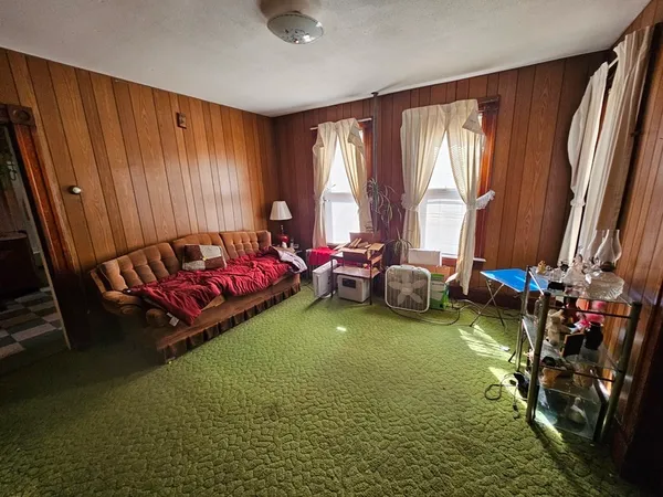 a bed room with a bed and a window