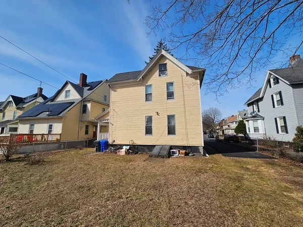 a view of a house with a yard