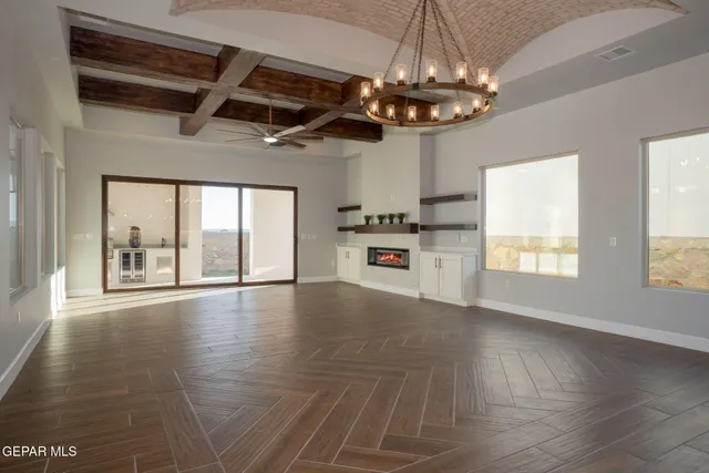a view of a kitchen with a stove cabinets and wooden floor
