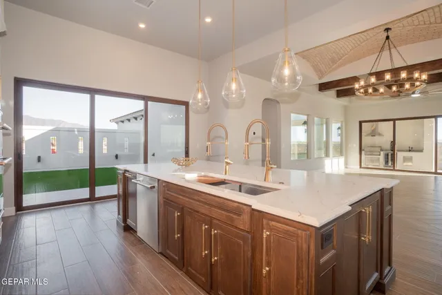 a kitchen with kitchen island cabinets and wooden floor