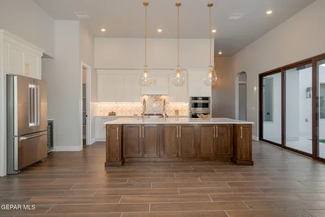 a view of a livingroom with a fireplace and wooden floor