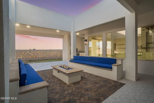 a view of a white house with a yard