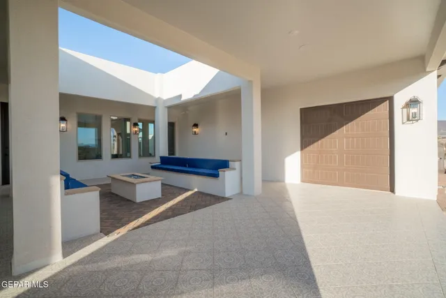 an aerial view of a house with a patio
