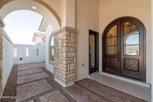 view of room with window and hallway