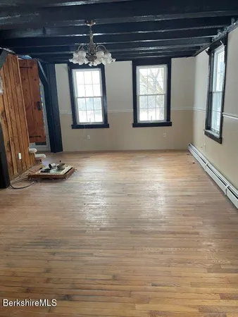a view of room with a ceiling fan and window