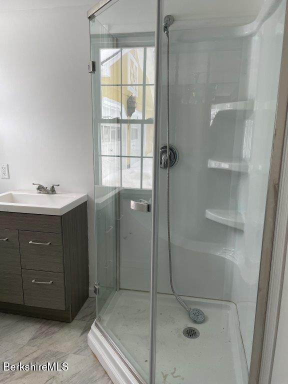 18 West Mountain Road Cheshire, MA 01225 - Photo 17 of 29 a bathroom with a shower sink and mirror