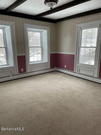 an empty room with windows