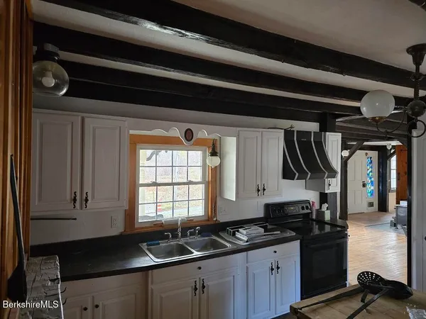 a kitchen with a stove and a sink