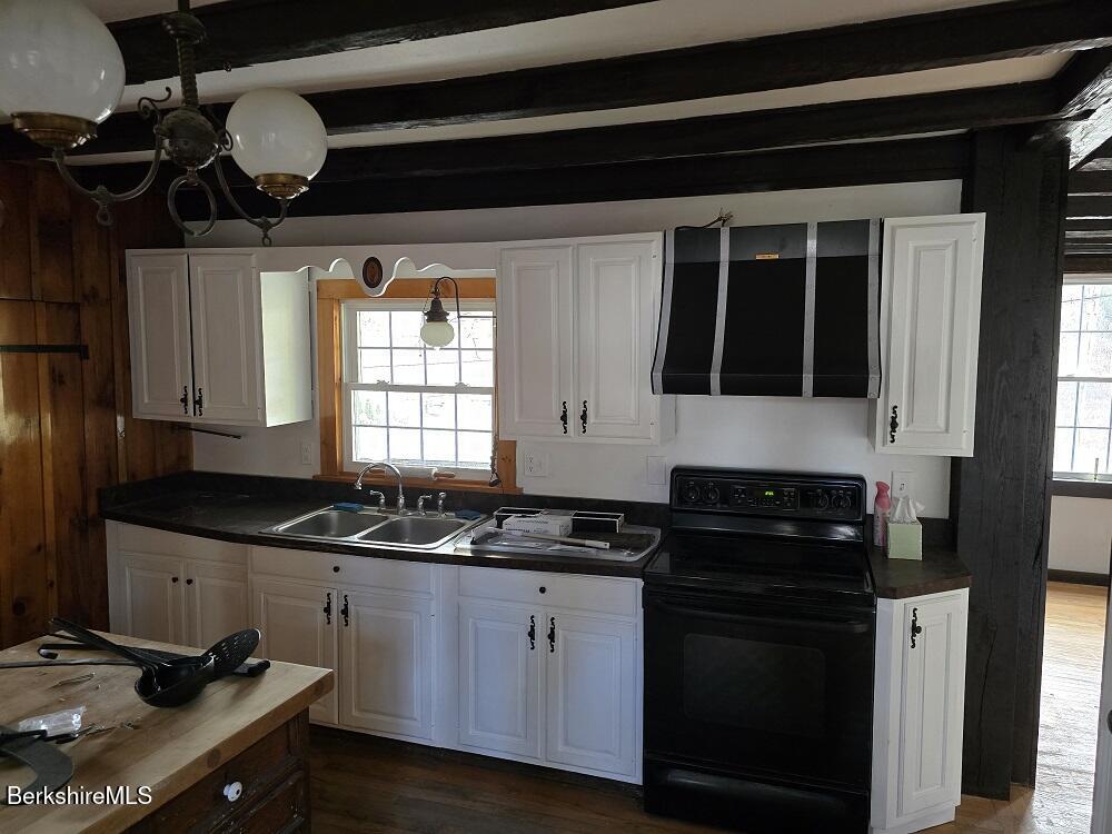 18 West Mountain Road Cheshire, MA 01225 - Photo 6 of 29 a kitchen with granite countertop a sink a stove and cabinets