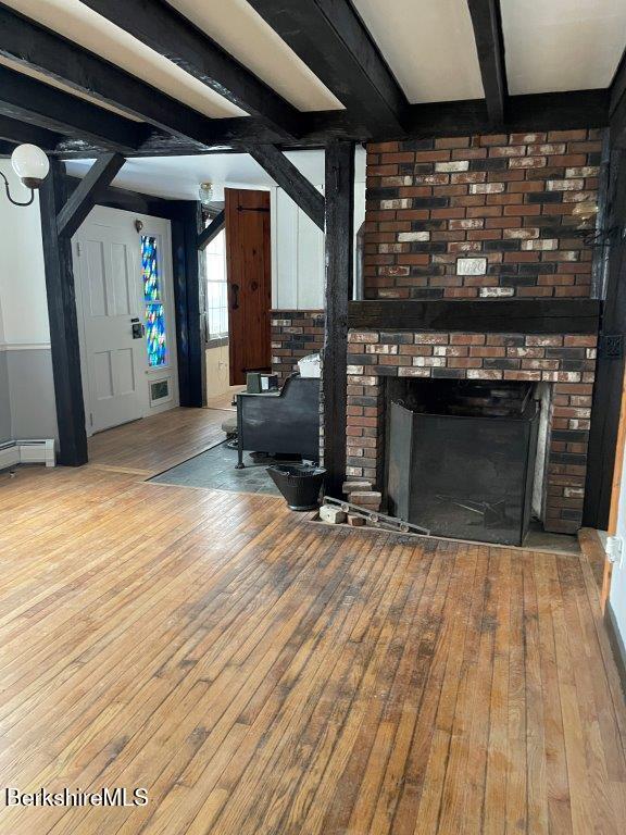 18 West Mountain Road Cheshire, MA 01225 - Photo 8 of 29 an empty room with wooden floor fireplace and windows