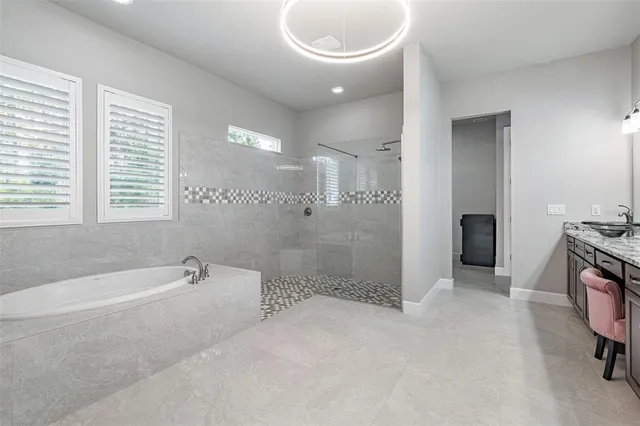 a bedroom with bed and a window