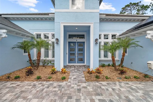 a living room with furniture stairs and a window