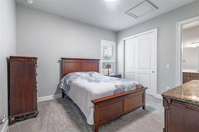 a utility room with cabinets washer and dryer