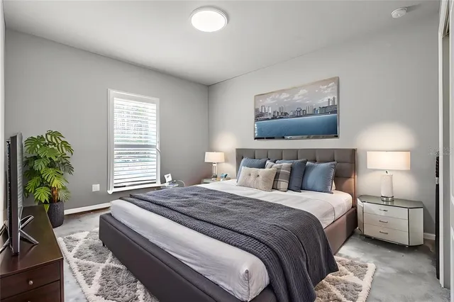 a view of a house with pool fire pit and chairs next to a yard