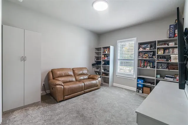 an aerial view of a house with a yard and potted plants