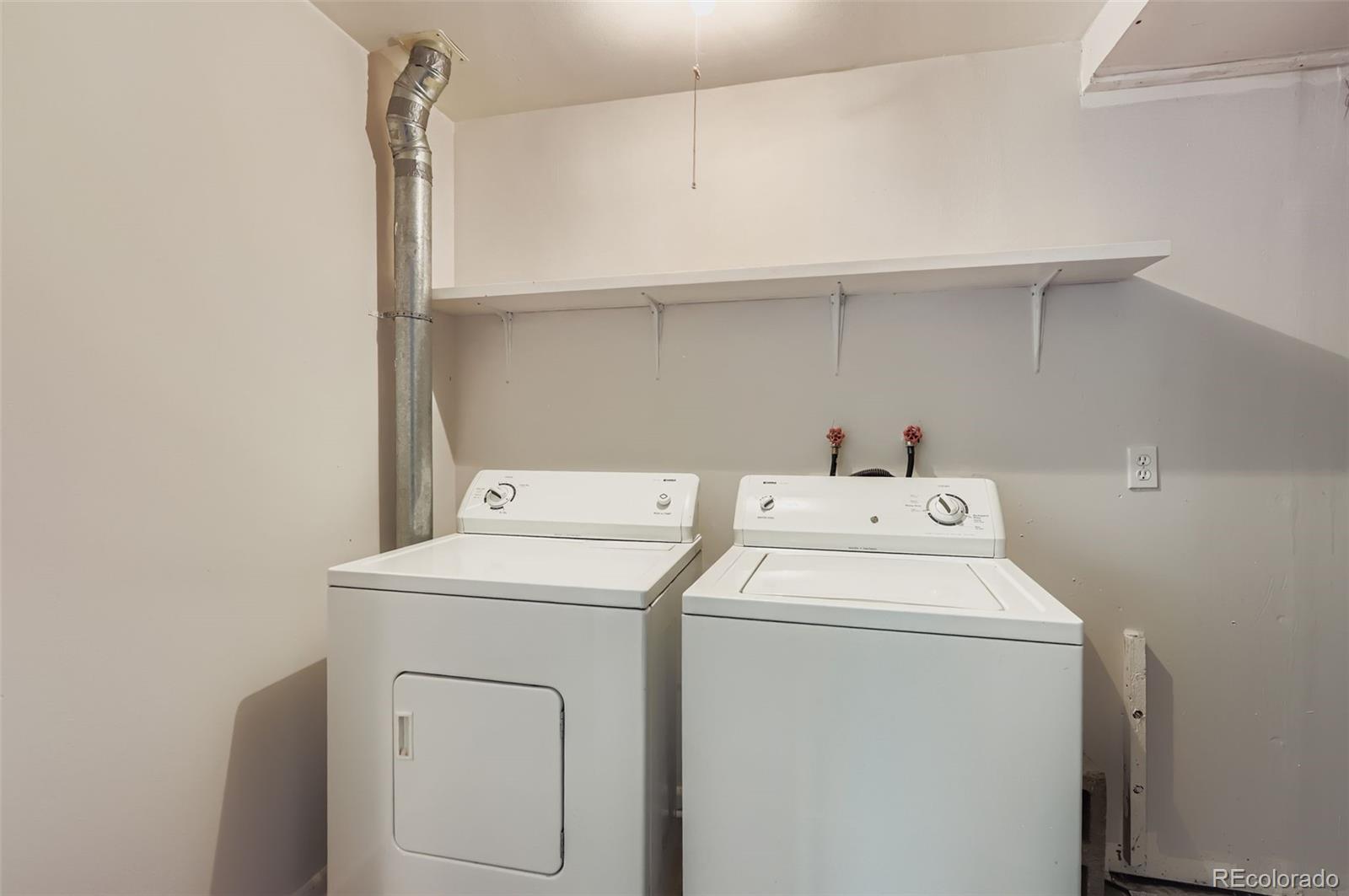 2412 West 20th Street Greeley, CO 80634 - Photo 21 of 23 a utility room with dryer and washer