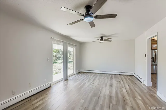 wooden floor in an empty room with a window