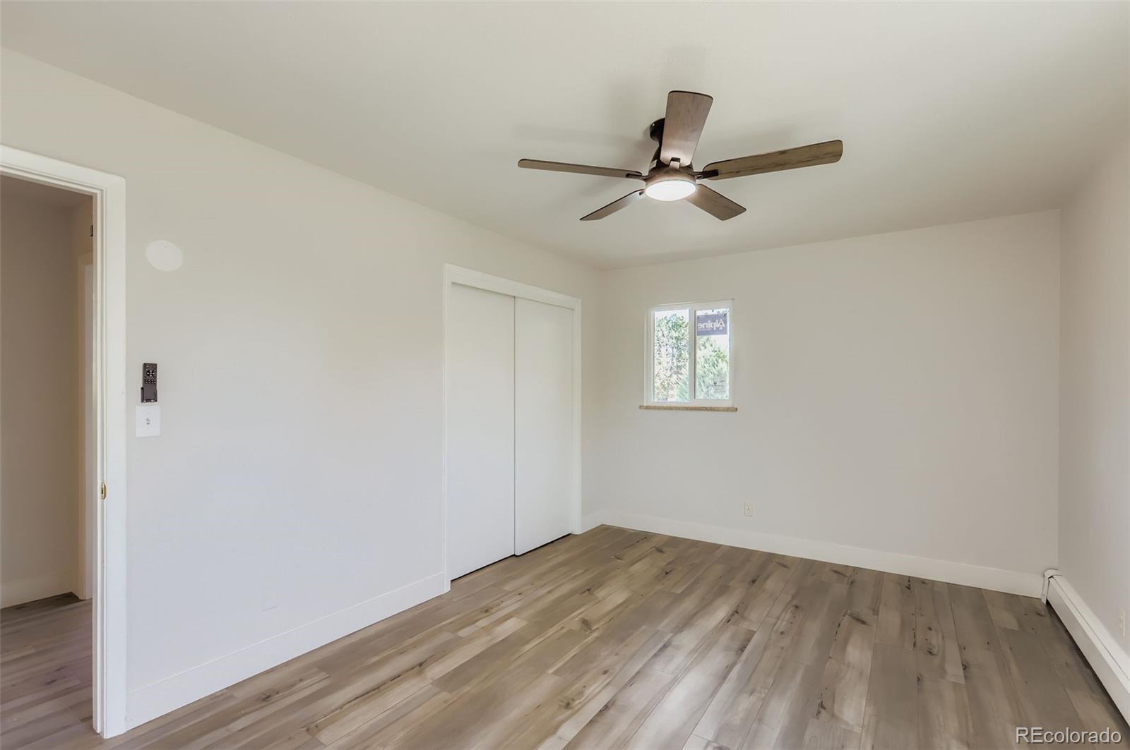 2412 West 20th Street Greeley, CO 80634 - Photo 9 of 23 a view of empty room with wooden floor