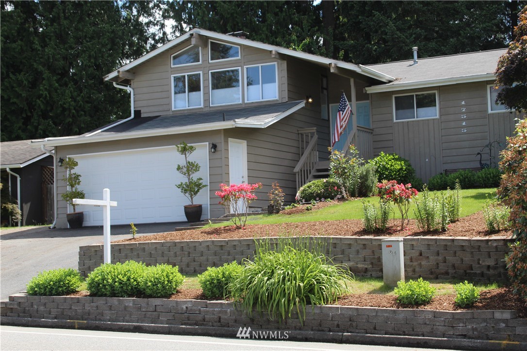 17515 Brook Boulevard Bothell, WA 98012 - Photo 1 of 36 a front view of a house with garden