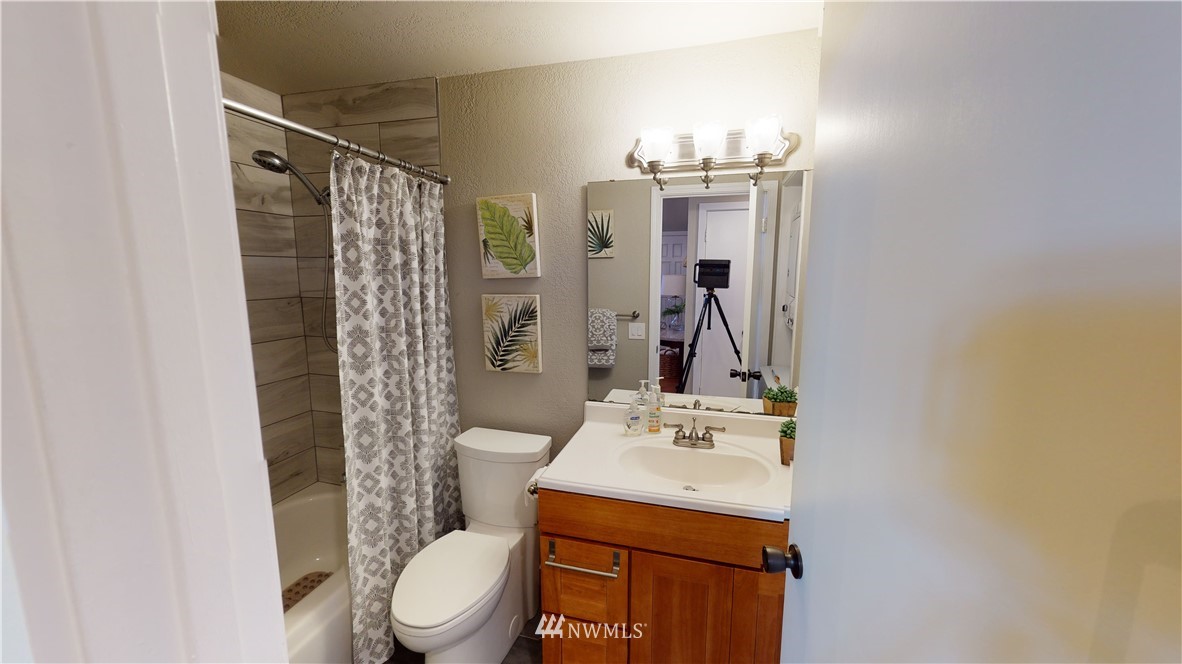 17515 Brook Boulevard Bothell, WA 98012 - Photo 11 of 36 a bathroom with a sink vanity mirror and toilet