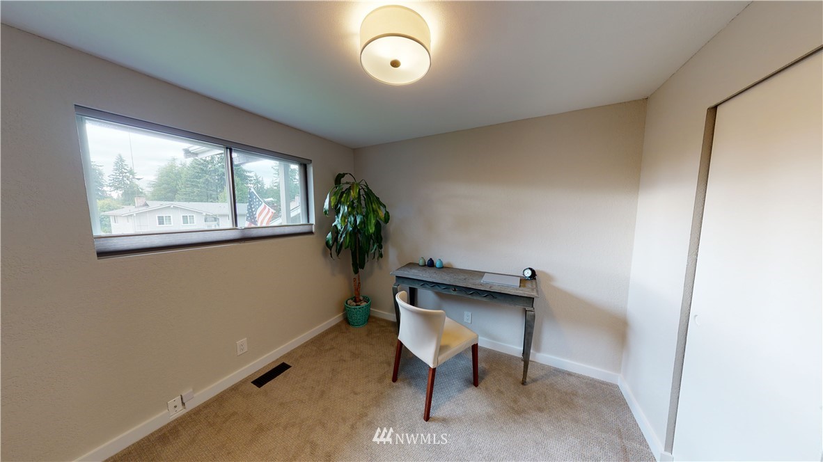 17515 Brook Boulevard Bothell, WA 98012 - Photo 15 of 36 a room with furniture and window