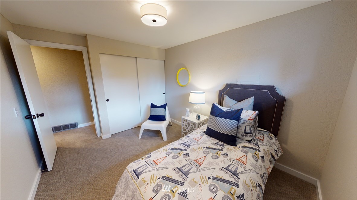 17515 Brook Boulevard Bothell, WA 98012 - Photo 17 of 36 a bedroom with a bed and a dresser