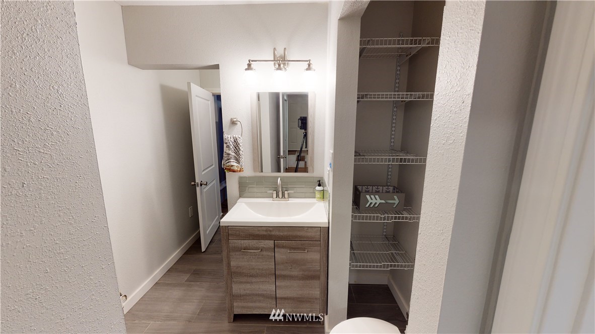 17515 Brook Boulevard Bothell, WA 98012 - Photo 21 of 36 a bathroom with a sink and mirror