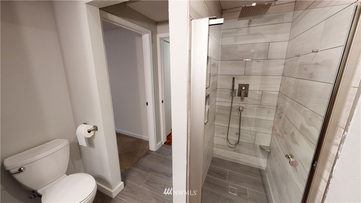 17515 Brook Boulevard Bothell, WA 98012 - Photo 22 of 36 a bathroom with a toilet and a shower