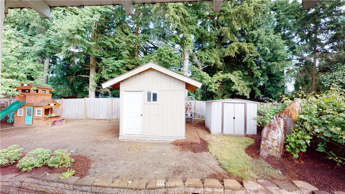 17515 Brook Boulevard Bothell, WA 98012 - Photo 25 of 36 a view of house with backyard