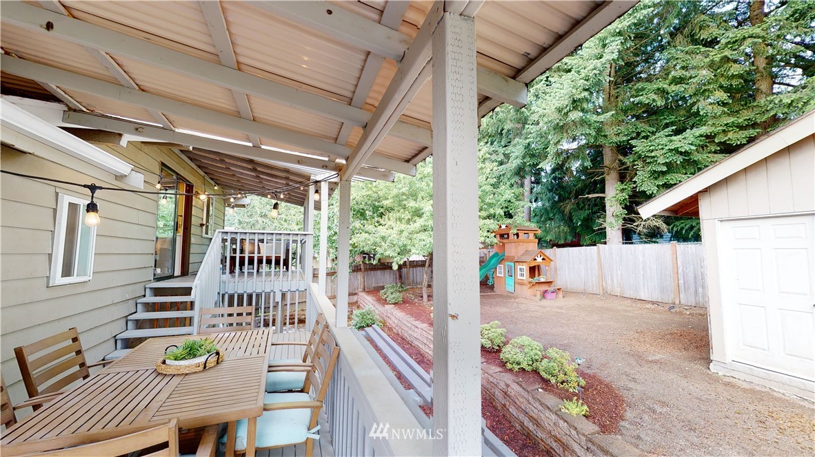 17515 Brook Boulevard Bothell, WA 98012 - Photo 27 of 36 a view of a balcony with chairs and a table