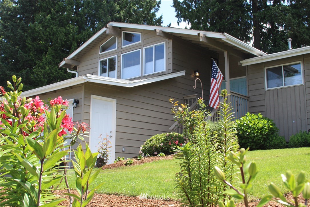 17515 Brook Boulevard Bothell, WA 98012 - Photo 29 of 36 a front view of a house with a yard