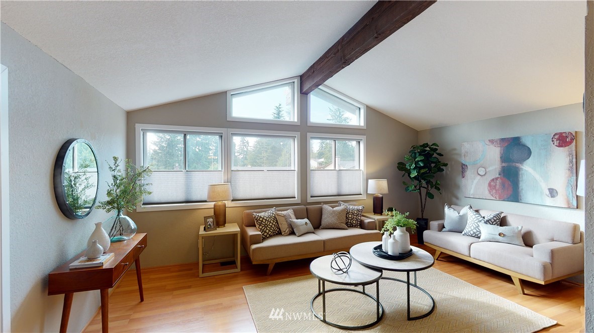 17515 Brook Boulevard Bothell, WA 98012 - Photo 5 of 36 a living room with furniture and a large window