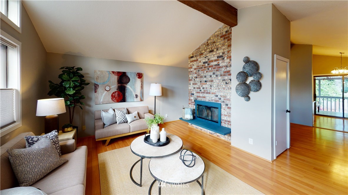 17515 Brook Boulevard Bothell, WA 98012 - Photo 6 of 36 a living room with furniture and a fireplace