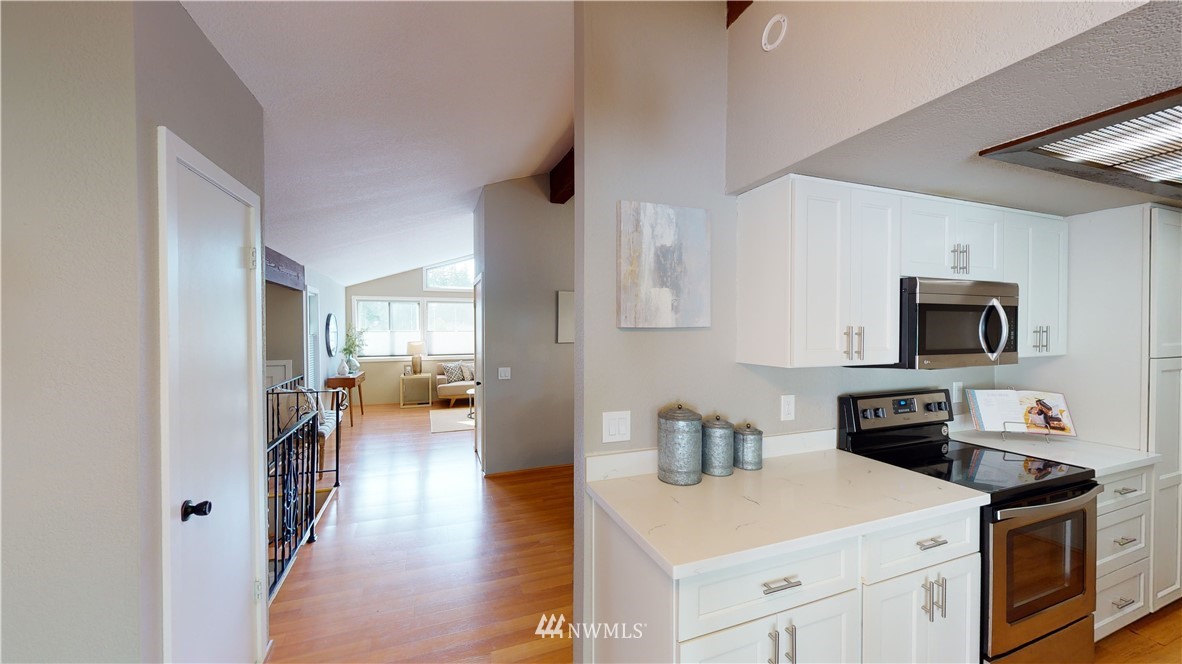 17515 Brook Boulevard Bothell, WA 98012 - Photo 10 of 36 a kitchen with a stove a sink and a microwave