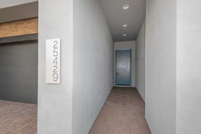 a view of a big room with windows and brick walls