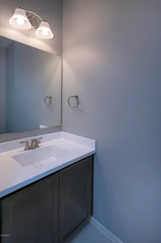 a kitchen with a sink and a stove top oven
