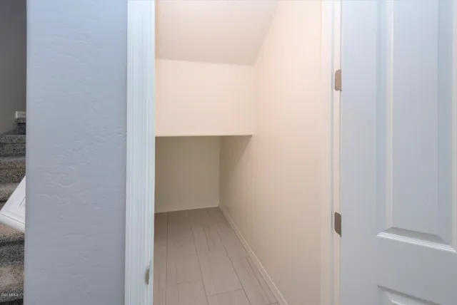 a view of a hallway with stairs