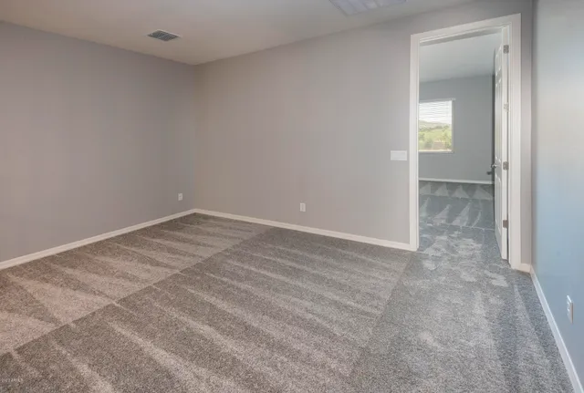 a view of a hallway with stairs