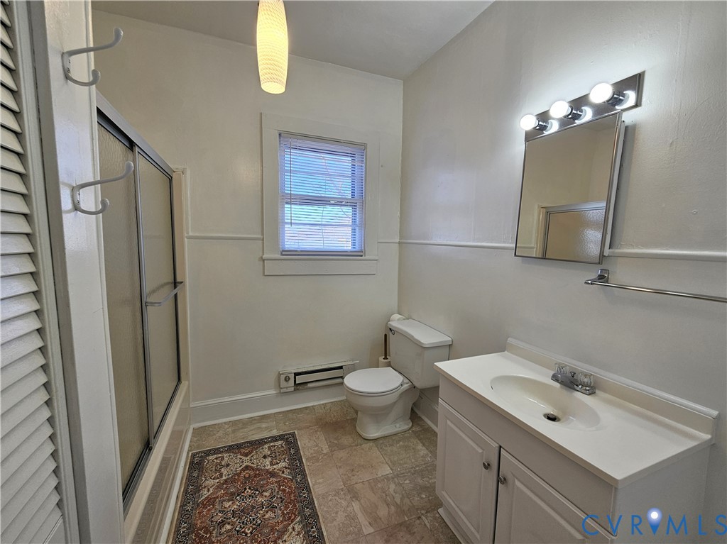 74 Conner Street Dillwyn, VA 23936 - Photo 17 of 46 a bathroom with a toilet sink and mirror