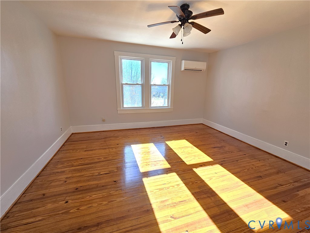 74 Conner Street Dillwyn, VA 23936 - Photo 25 of 46 a view of an empty room with wooden floor and a window