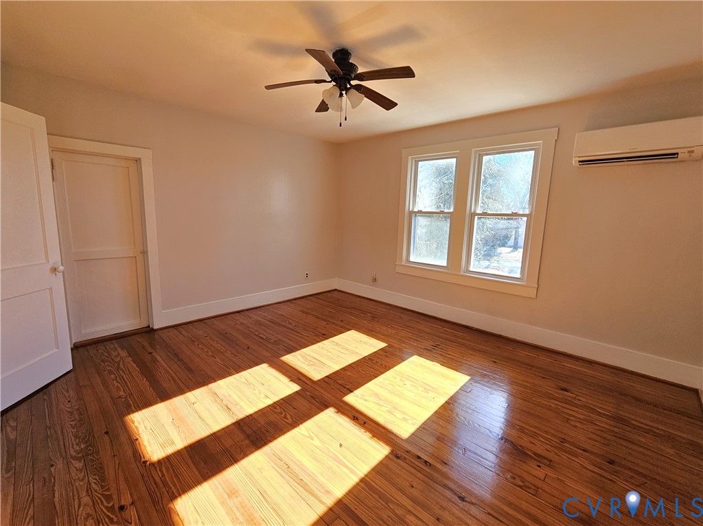 74 Conner Street Dillwyn, VA 23936 - Photo 26 of 46 wooden floor in an empty room with a window