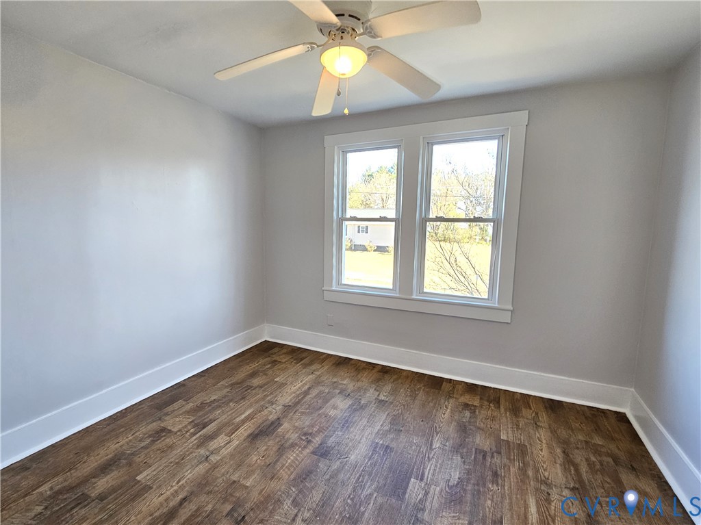 74 Conner Street Dillwyn, VA 23936 - Photo 27 of 46 a view of an empty room with window and wooden floor